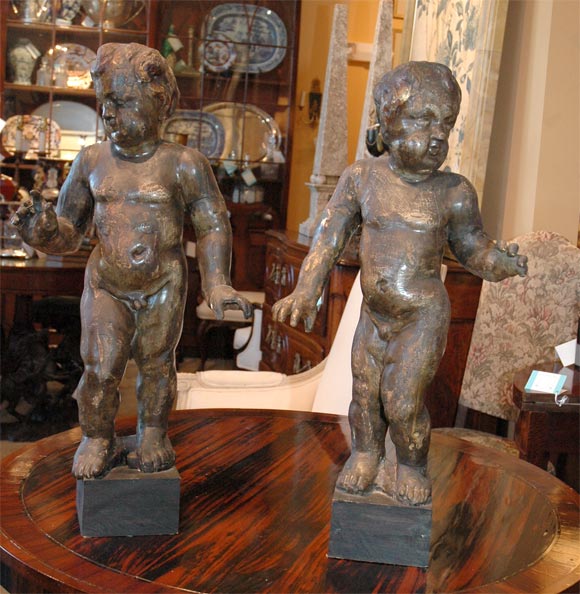 Pair of full figured wooden 18thC putti.  Hand carved with wonderful movement.